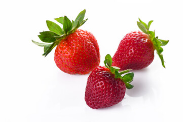 Set of ripe strawberries. Whole and cut berries isolated on white background.