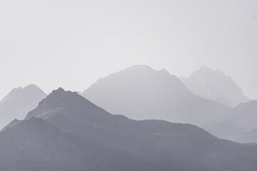 Panorama of a mountain range in the morning at dawn, tonal perspective of mountains in the morning...