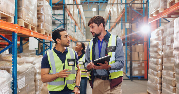 Men, tablet and inspection for stock in warehouse with teamwork, inventory check and logistics business. Quality assurance, tech and team discussion in factory for export industry and ecommerce store