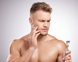 Doubt, man and razor for shaving face with wellness, skincare and ideas for hygiene in studio....