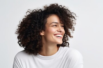 Portrait of a happy young african american woman with curly hair