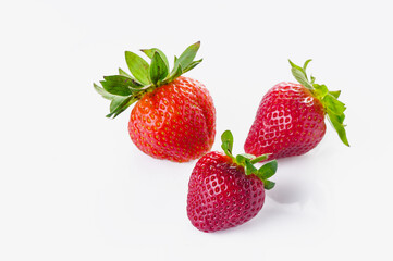 Pile of delicious fresh red strawberries on white background