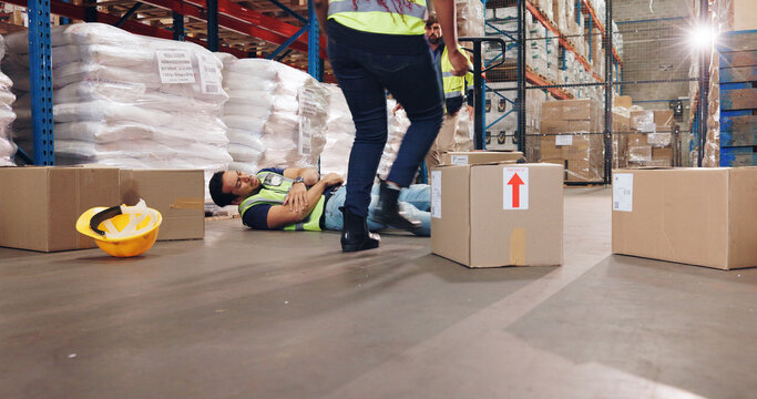 Accident, fall and stock with man in warehouse for delivery, distribution or supply chain logistics. Fail, injury or mistake and person on floor of plant with box for ecommerce, retail or safety