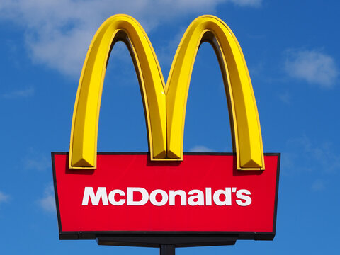 Mcdonalds sign nice bright logo against a blue sky