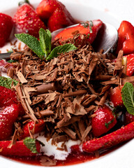 Strawberries with chocolate and mint close-up