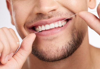 Closeup, man and flossing teeth for hygiene with wellness, mouth care and gum health for fresh...