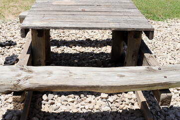 Fototapeta premium A bench for relaxing in a city park on the seashore.