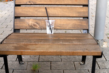 A bench for relaxing in a city park on the seashore.