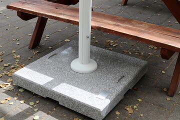 A bench for relaxing in a city park on the seashore.