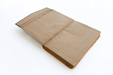 inner page of a very old book. yellowed natural paper texture. on isolated white background. clean close-up.