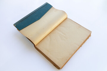 inner page of a very old book. yellowed natural paper texture. on isolated white background. clean close-up.