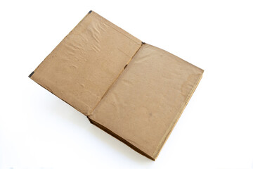 inner page of a very old book. yellowed natural paper texture. on isolated white background. clean close-up.