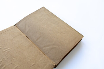 inner page of a very old book. yellowed natural paper texture. on isolated white background. clean close-up.