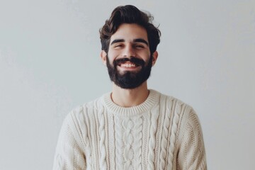 Fototapeta premium A portrait of a person with a beard and sweater, suitable for use as a character illustration or to represent a creative professional