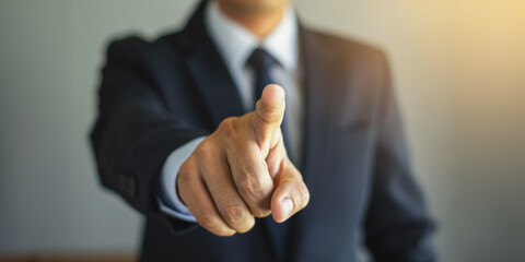 Businessman pointing finger in focus