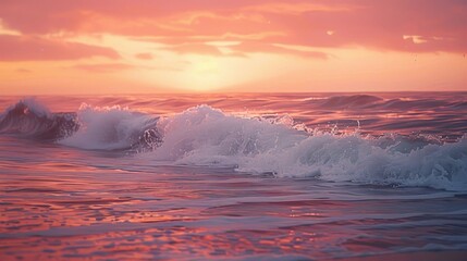 Fototapeta premium Curved waves gently crashing at sunset, vibrant orange and pink sky, peaceful beach moment.