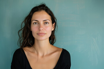 Fototapeta premium A close up portrait of a young woman with a subtle smile