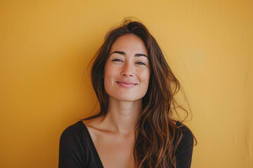 Obraz premium A close up portrait of a young woman with a subtle smile