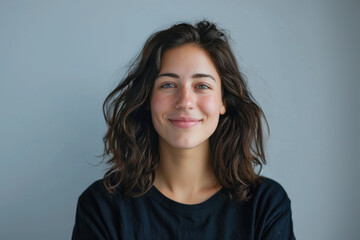 Fototapeta premium A close up portrait of a young woman with a subtle smile
