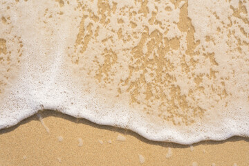 Wave on sand, closeup 