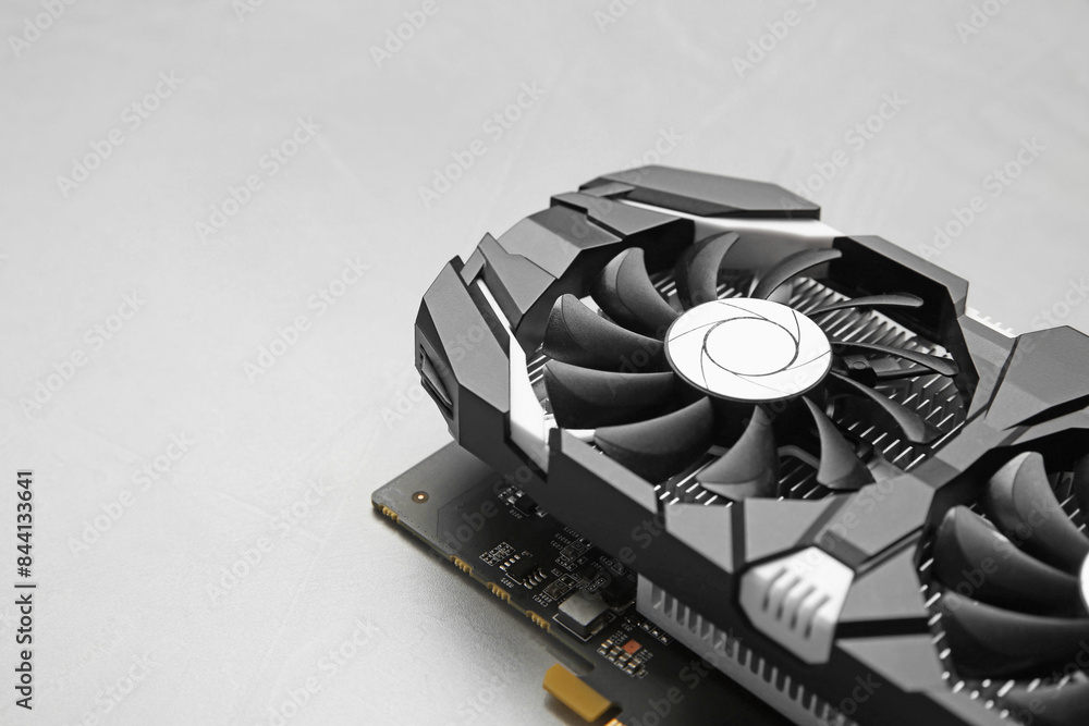 Fototapete computer graphics card on gray textured background, closeup. space for text