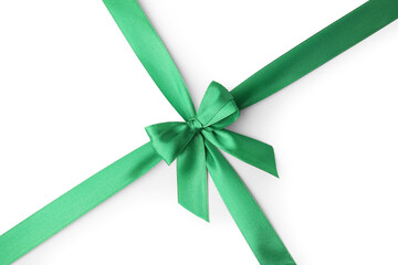 Green satin ribbon with bow isolated on white, top view