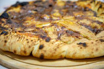 Traditional sweet Brazilian banana pizza with cinnamon, chocolate and catupiry