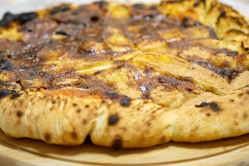 Traditional sweet Brazilian banana pizza with cinnamon, chocolate and catupiry