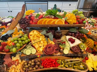 Charcuterie board full of colorful appetizing food grazing table
