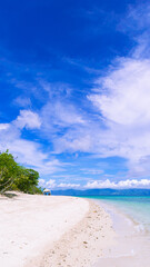 Bonbon Beach white sand on a sunny day. Portrait. Romblon Island, Philippines
