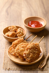 Deep fried chicken breast with stick, Thai street food