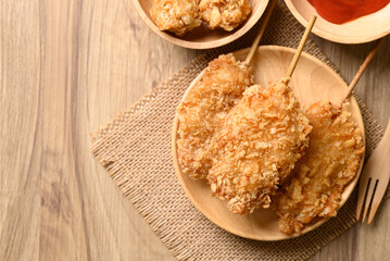 Deep fried chicken breast with stick, Thai street food, top view