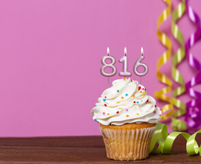 Birthday Cupcake With Candles Lit Forming The Number 816