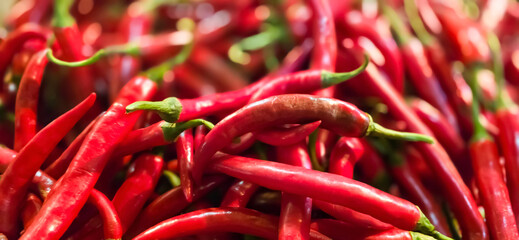 Red hot chilli peppers texture background, close up, A backdrop of Red hot chilli peppers, Street vegetable market, Group of Red hot chilli peppers