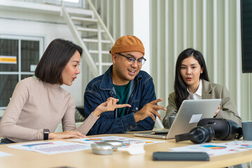 Happy diverse group Asian business start up freelance team analyzing statistics financial. Group Team of business people meeting conference discussion various topic corporate concept in office.