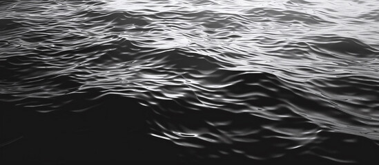 Black water background with ripples. Wave surface of a dark ocean or sea in computer graphics. 3D rendering of a black texture of water, oil, petroleum with waves and ripples