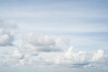 Cumulus clouds in the blue sky.