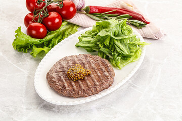 Frilled beef burger cutlet with iceberg