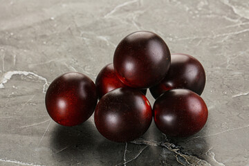 Raw ripe black kumato tomato