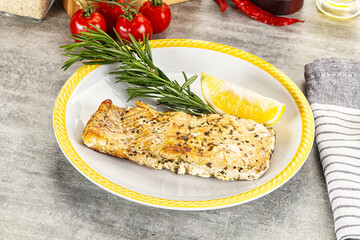 Baked salmon fish served rosemary