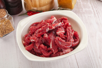 Raw beef meat - sliced strips