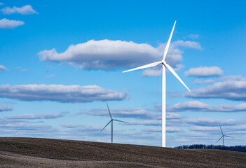wind turbine in the wind on dirt road