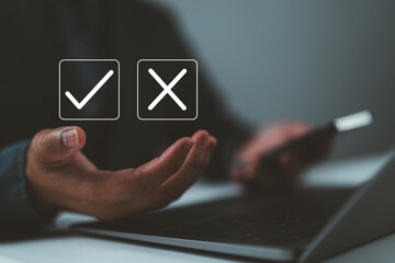 Businessman hands showing checks marks and wrong The idea is to decide to vote. think yes or no...