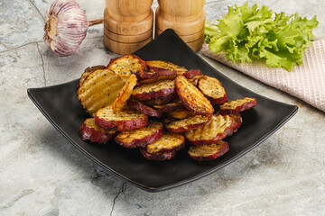 Baked red batat slices with herbs