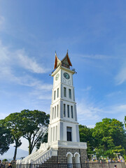 Jam Gadang landmark bukittinggi indonesia in the middle with blue Sky