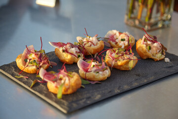 Elegant Gourmet Hors doeuvres on a Slate Platter, perfect for special occasions