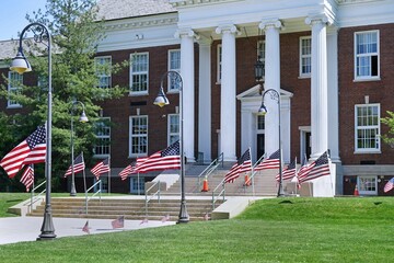 School building decorated with American flags for Memorial Day