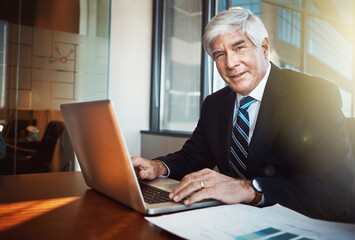 Businessman, ceo and portrait with laptop in office for experience with smile for confidence in workplace. Advocate, lawyer and law firm with manager or boss with senior, pride and expert in career.