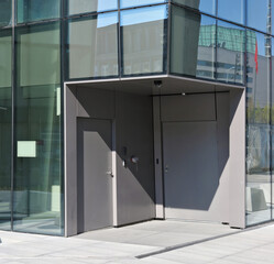 The service entrance to the office building is equipped with a fire hydrant and a video camera