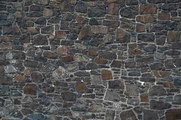 old brown stone wall texture and background, close up